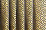 Geometria mintás arany és bronz színű sötétítő függöny textíl
