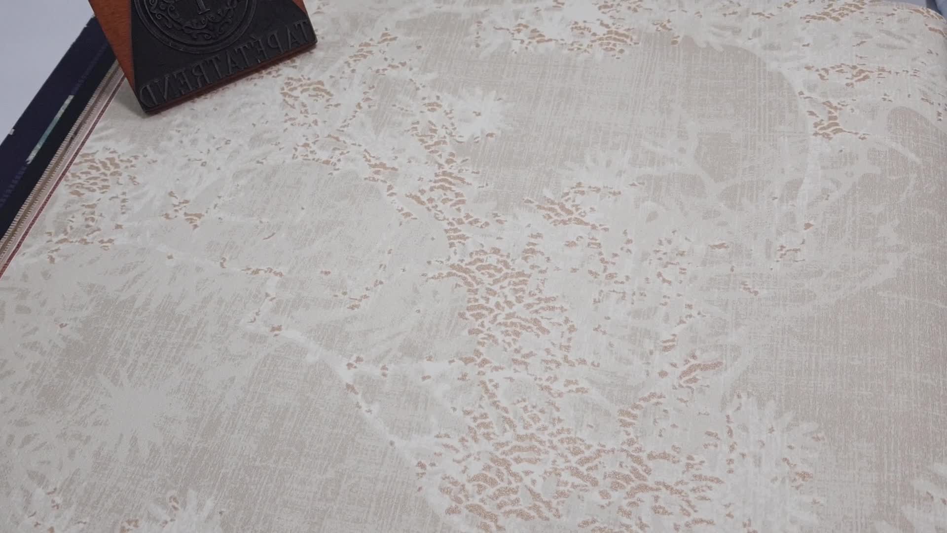 Bézs enyhén metál arany fényű absztrakt faág mintás vlies dekor tapéta