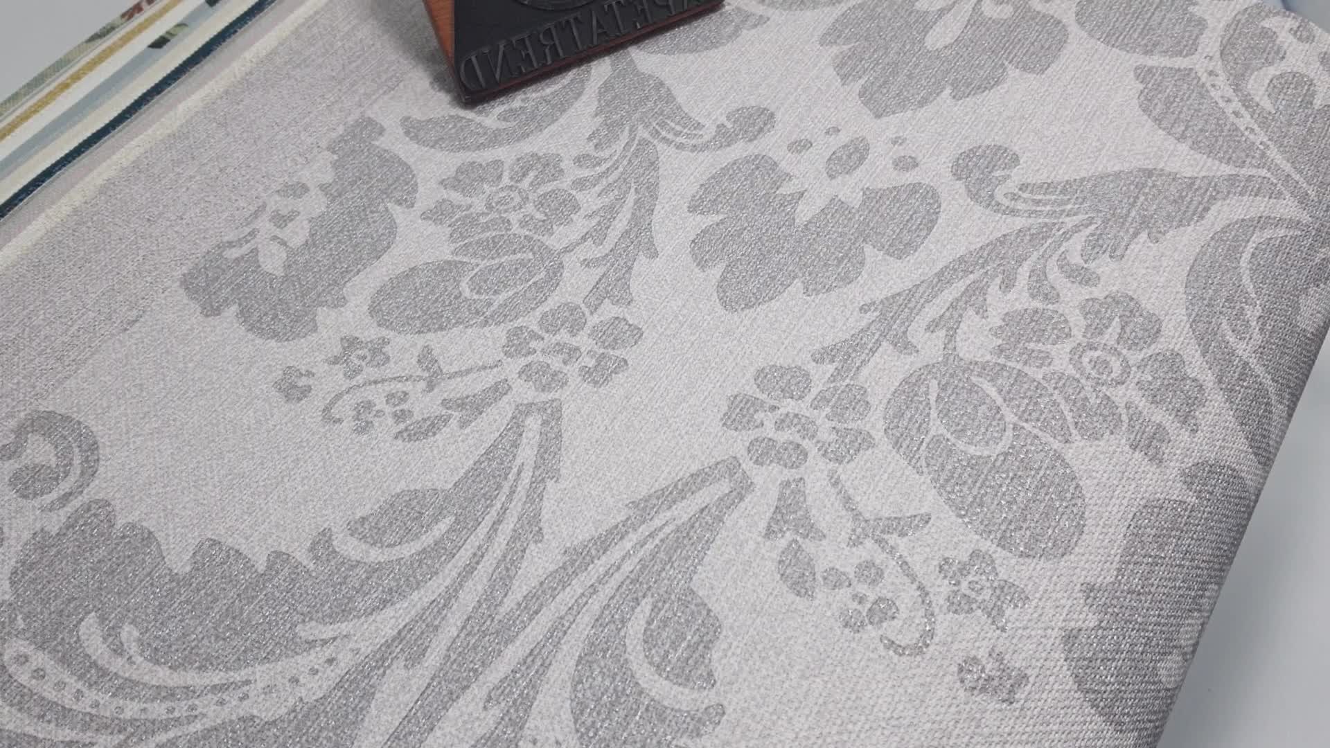 Barokk mintás vlies tapéta szürke színben finoman csillogó textilstruktúrált alapon