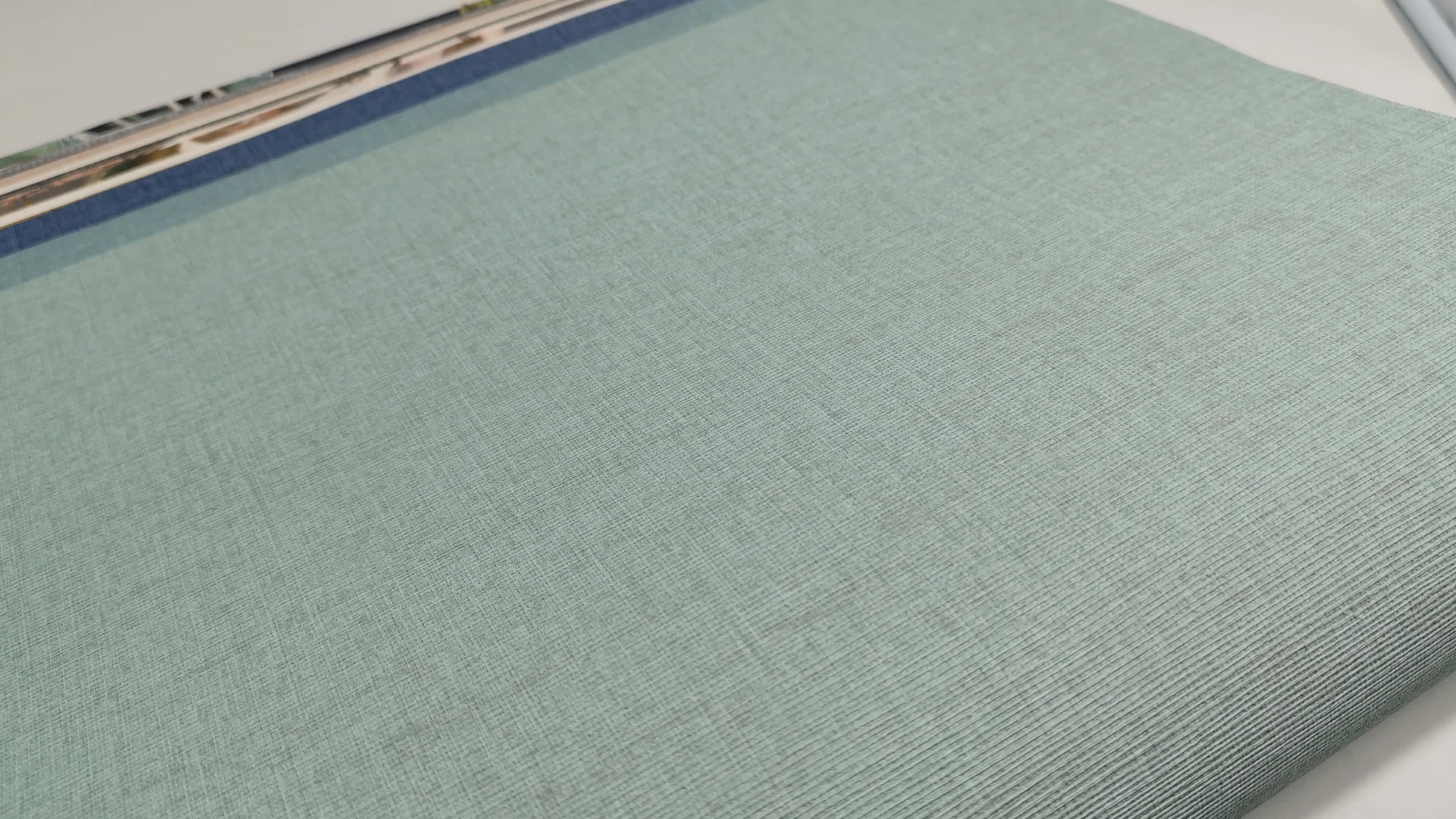 Halvány türkiz egyszínű textil hatású vlies dekor tapéta