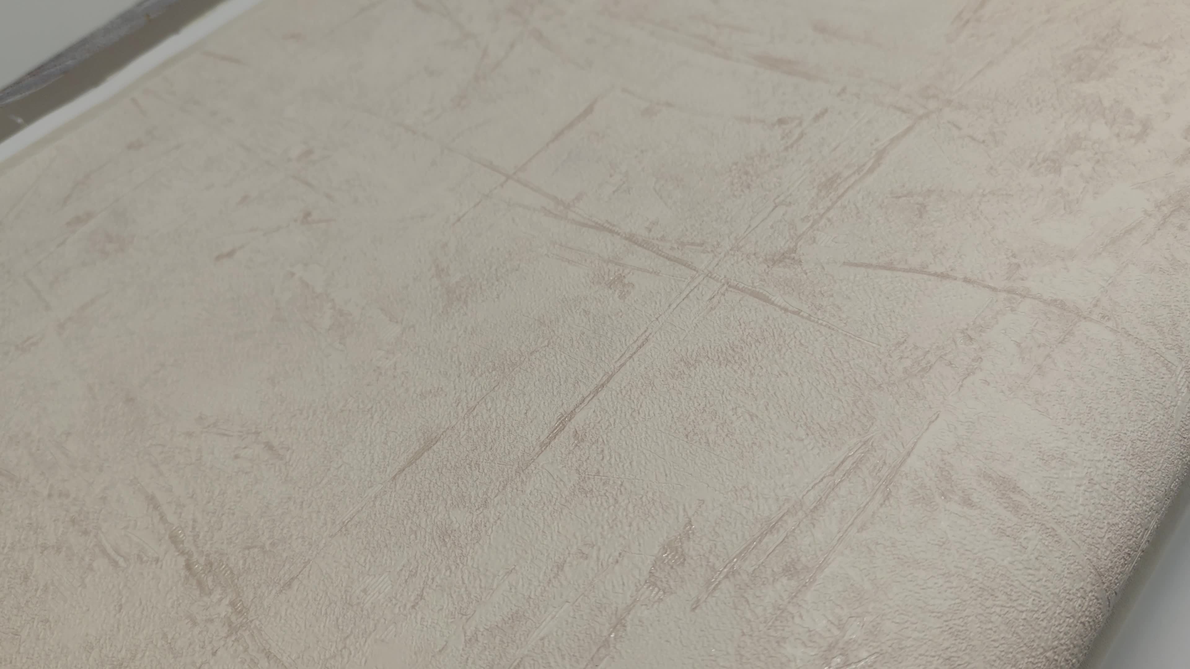 Loft hangulatú struktúrált koptatott vakolat hatású beige színű design tapéta