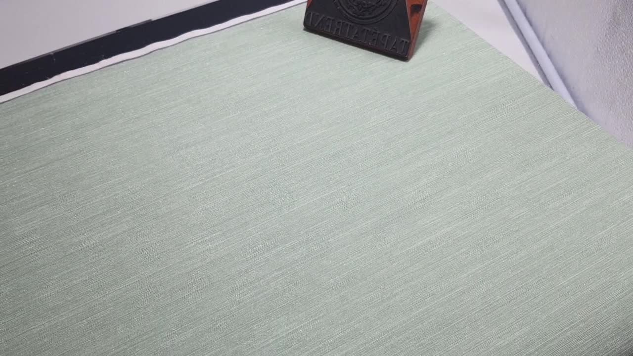 Zöld enyhén csilámos erezett anygában mintás design tapéta