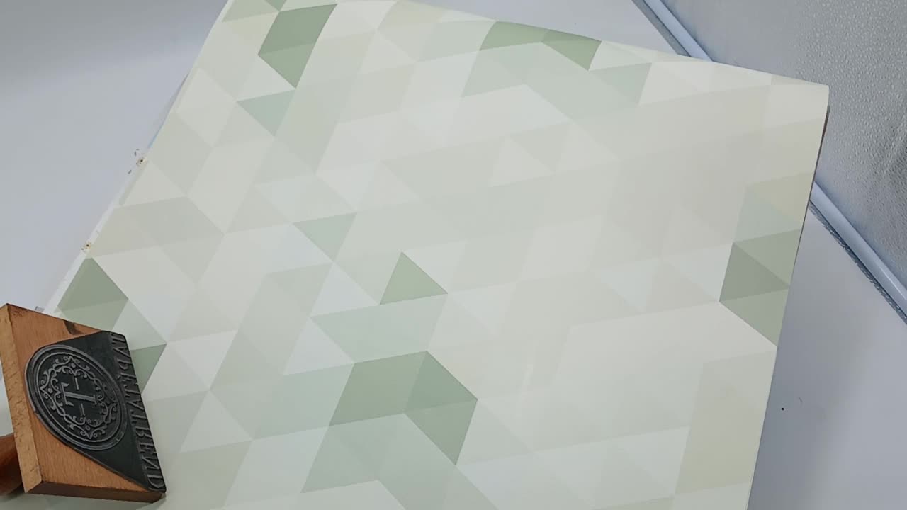 Zöld háromszög mintás gyerek tapéta