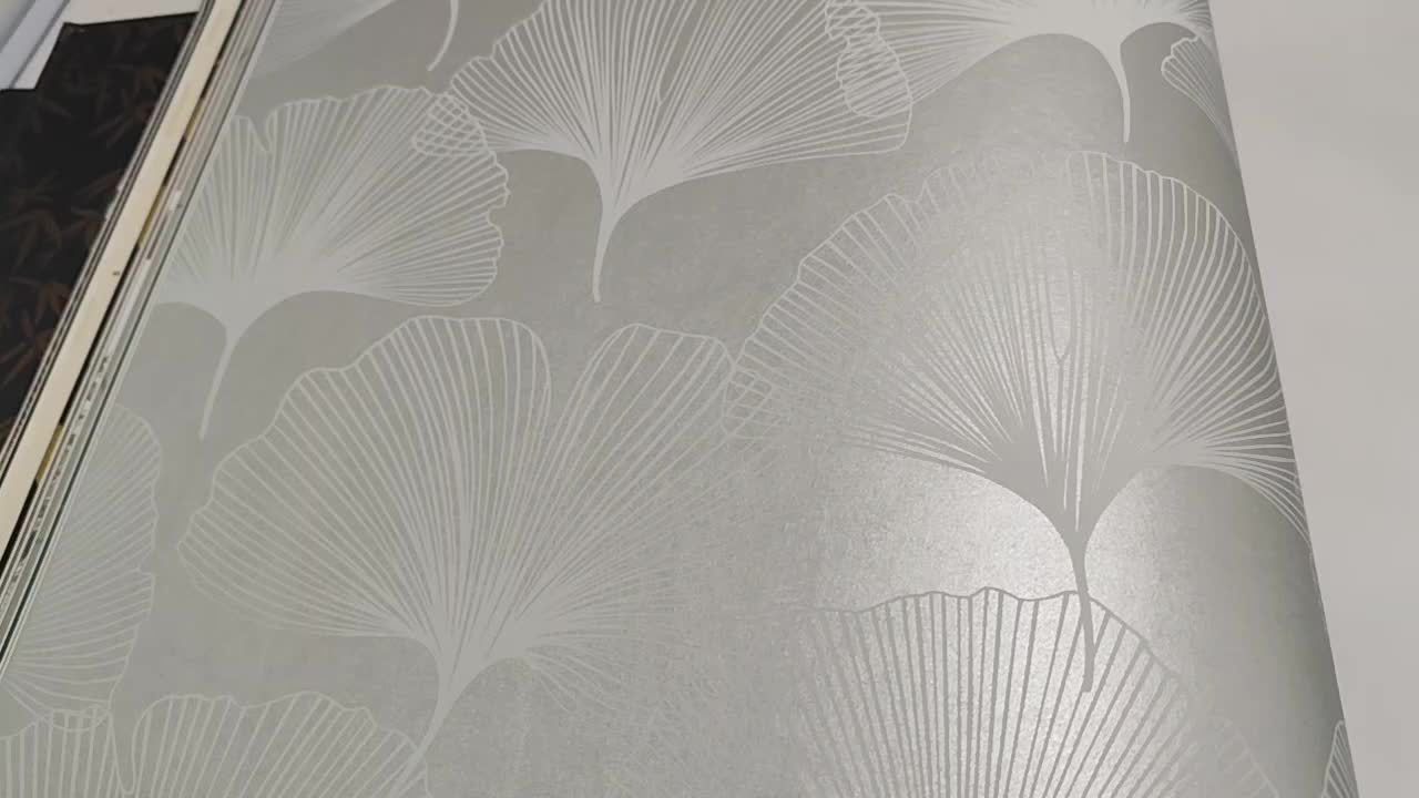 Gyöngyház felületű pasztel zöld minimalista ginkó levél mintás design tapéta