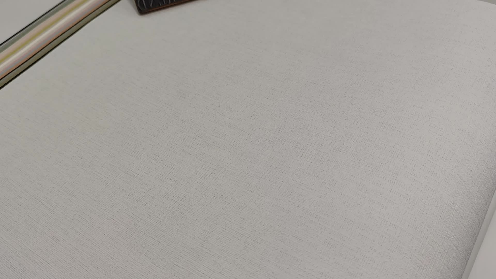 Szürke vinyl tapéta egyszínű textilhatású mintával mosható