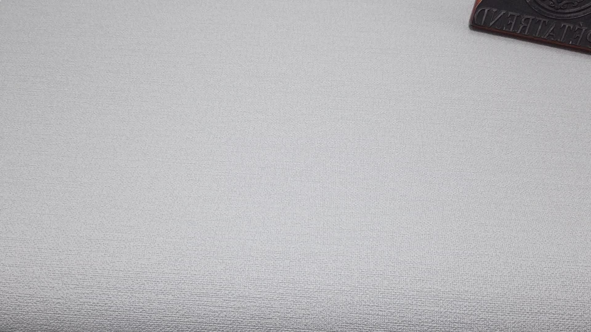 Egyszínű textil hatású design tapéta szürke színben