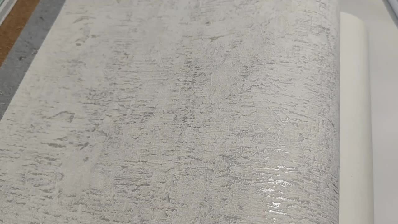 Szürke stukrurált vlies dekor tapéta