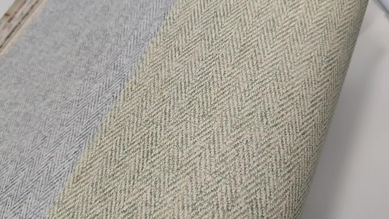 Apró shevron mintás enyhén struktúrált halvány zöld dekor tapéta