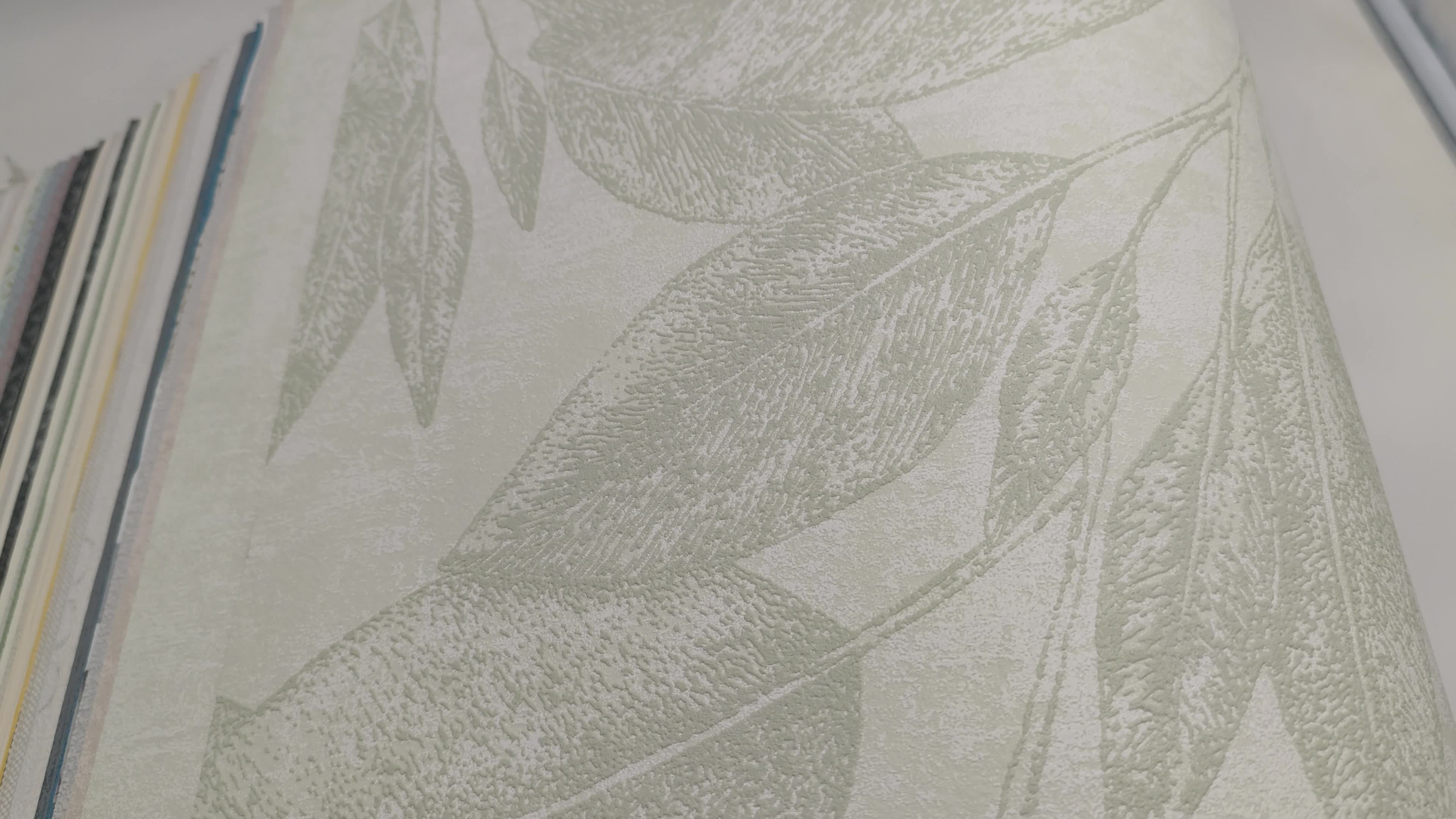 Zöld nagyléptékű levélmintás vlies design tapéta