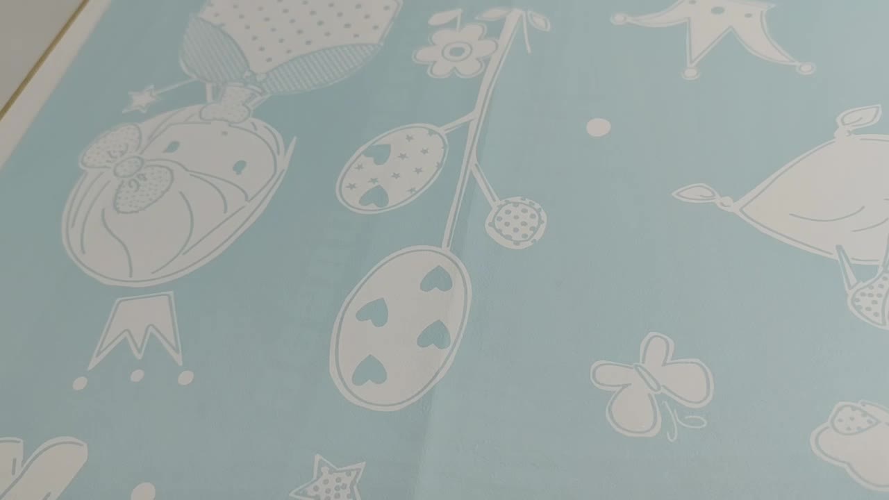 Kék gyerektapéat tündér, unikornis mintákkal