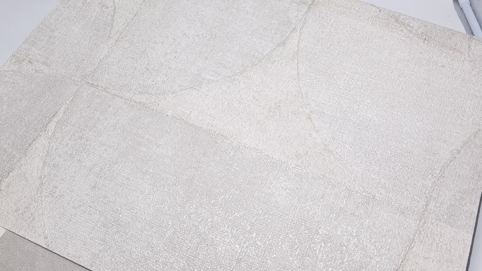 Szürke tapéta geometrikus mintázattal