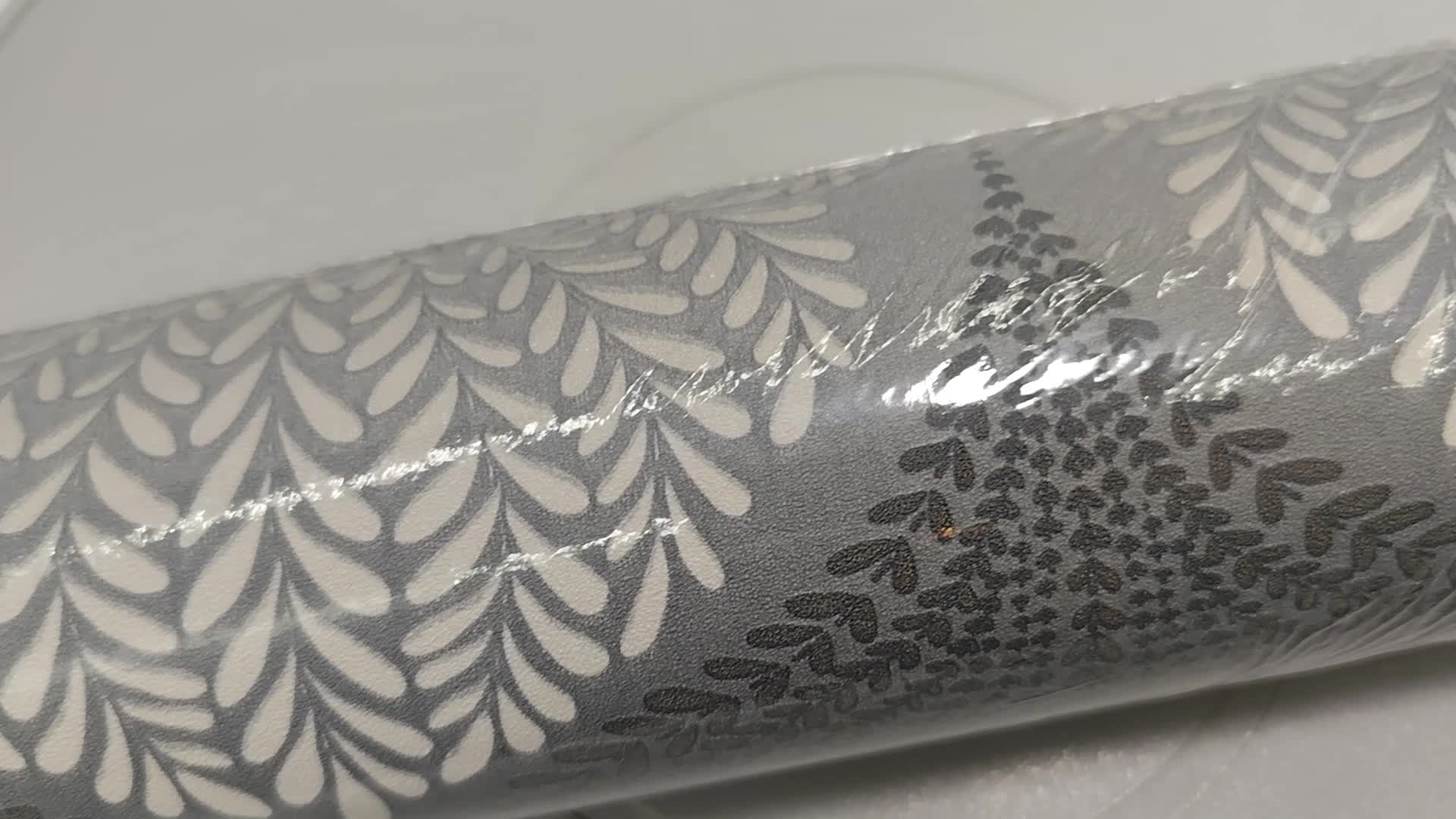 Orientális stílusú kagyló mintás vlies tapéta sötétszürke színben